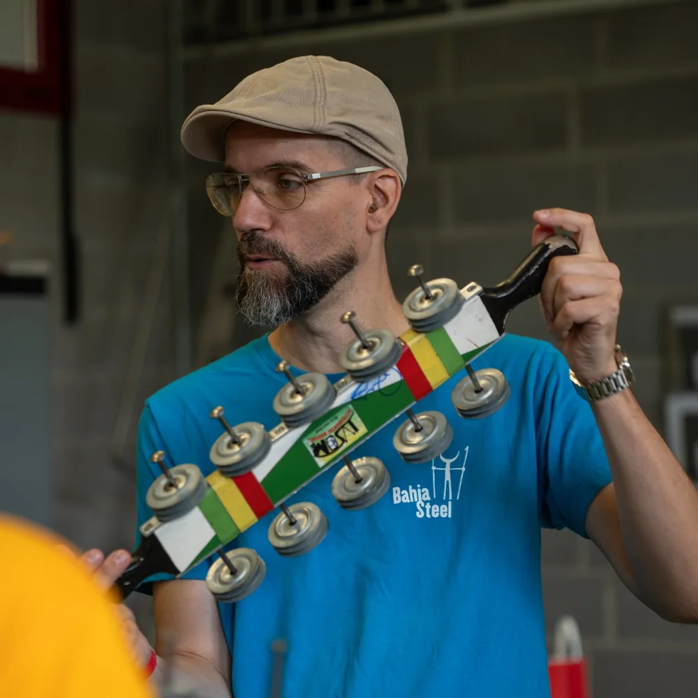 Chris demonstrating chocalho technique during a samba workshop