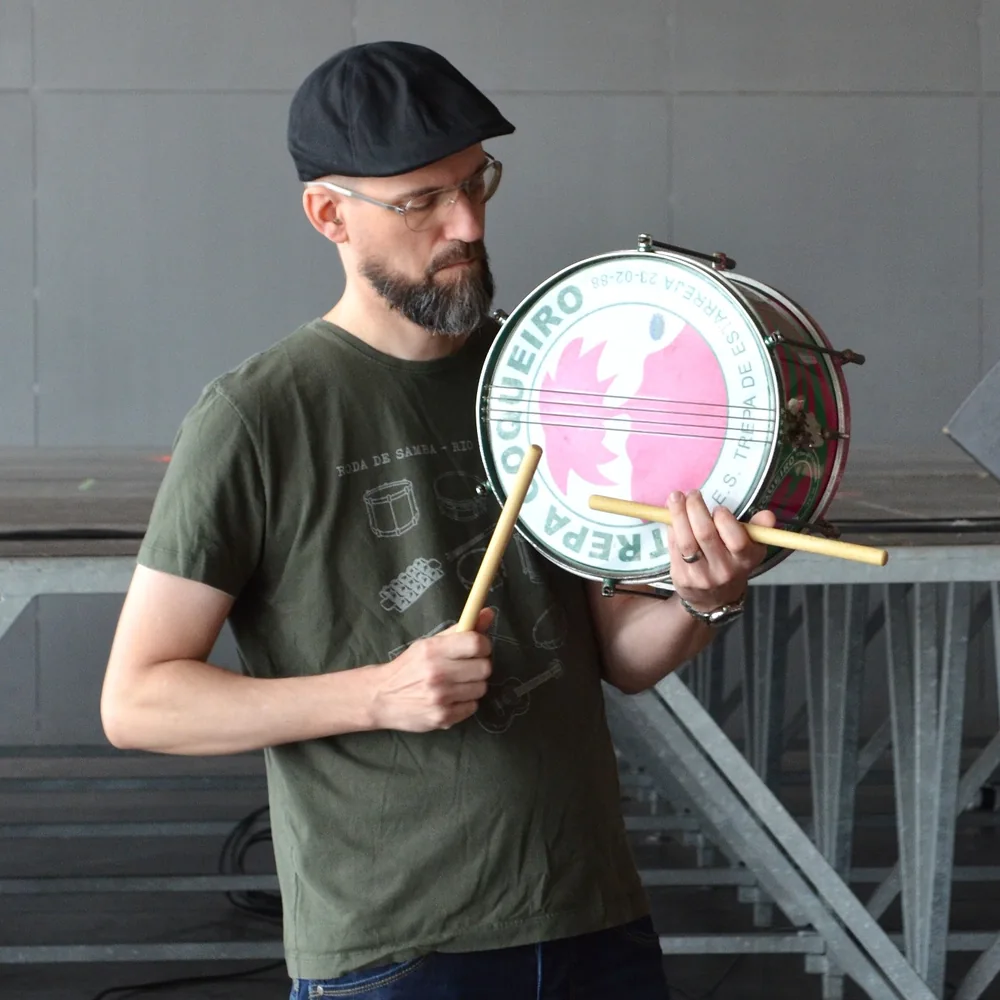 Chris demonstrating samba snare drum technique with a pair of drumsticks