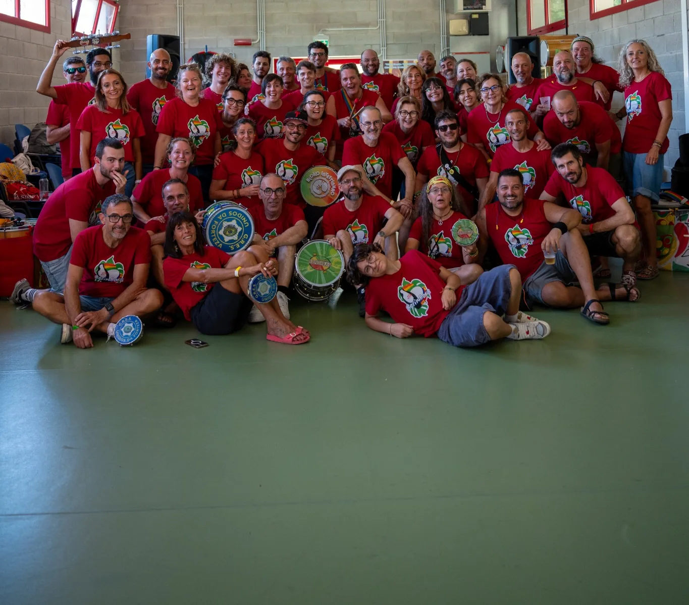 An international samba workshop group celebrating together with percussion instruments